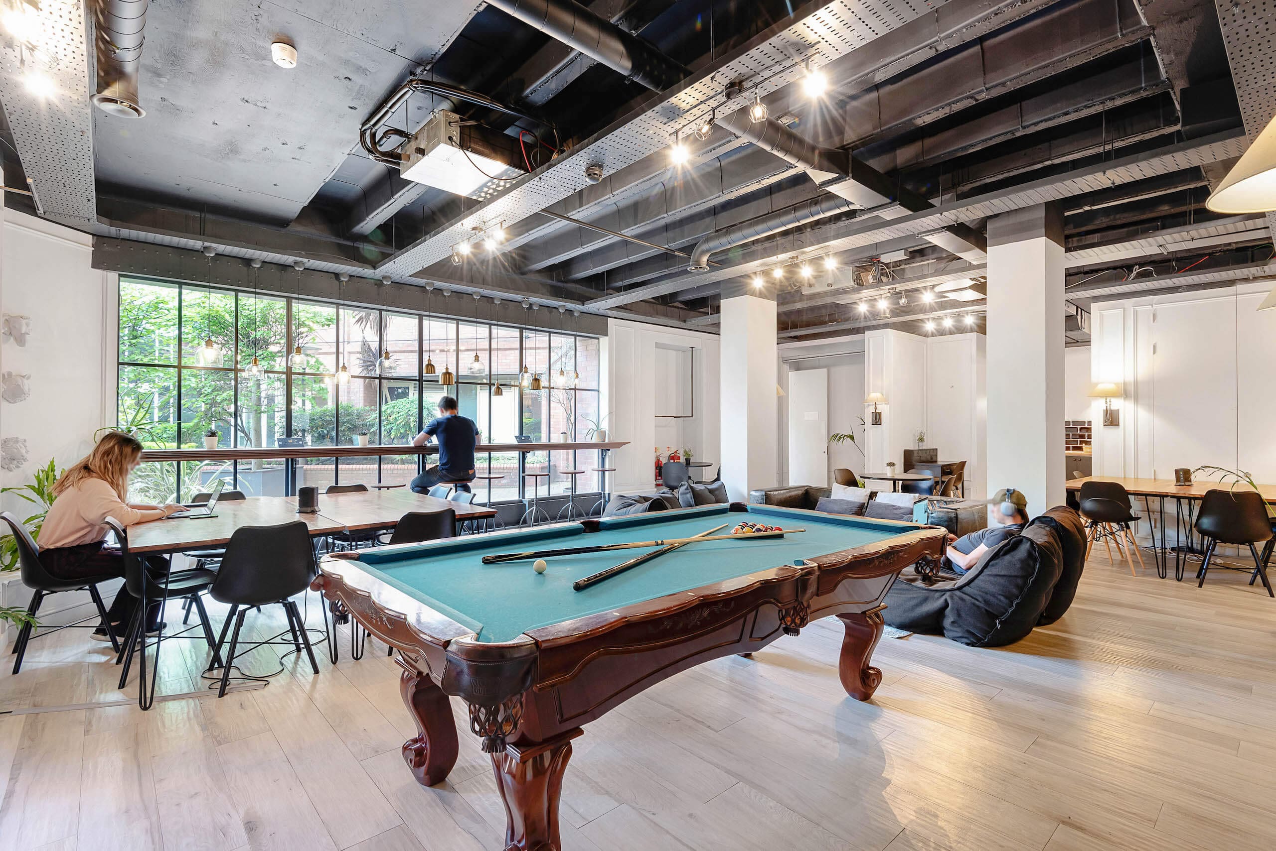 coliving-lounge-modern-workspace-pool-table-laptop-collaboration-west-court-gravity-co