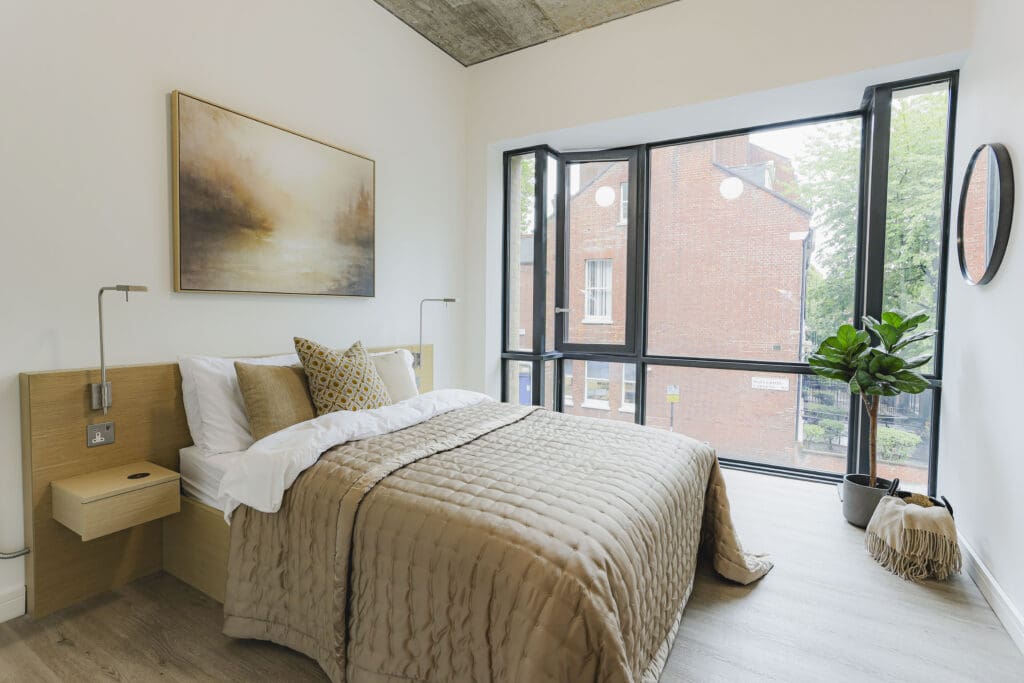 Bedroom inside a one-bedroom apartment at Gravity Co Hammersmith